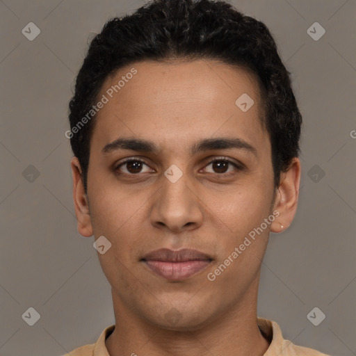 Joyful latino young-adult male with short  brown hair and brown eyes