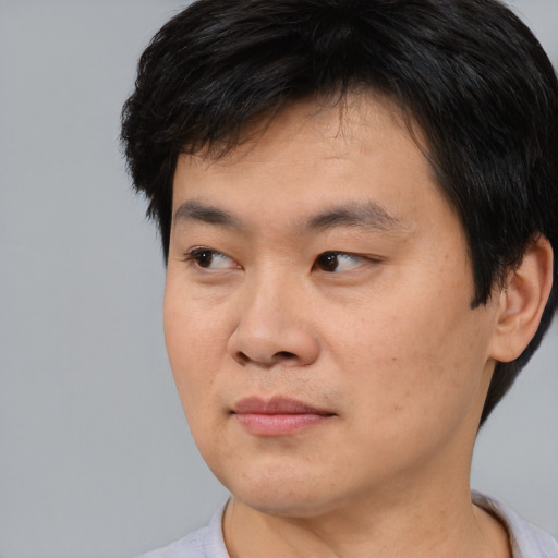 Neutral asian young-adult male with short  black hair and brown eyes