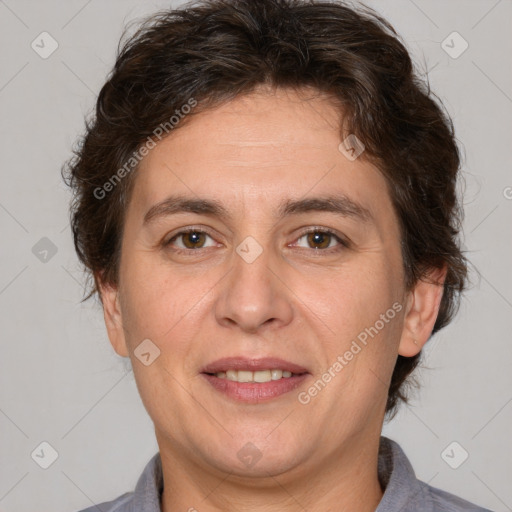 Joyful white adult female with short  brown hair and brown eyes