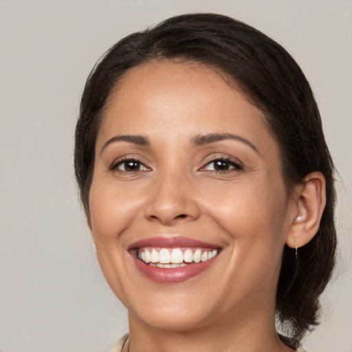 Joyful white young-adult female with medium  brown hair and brown eyes