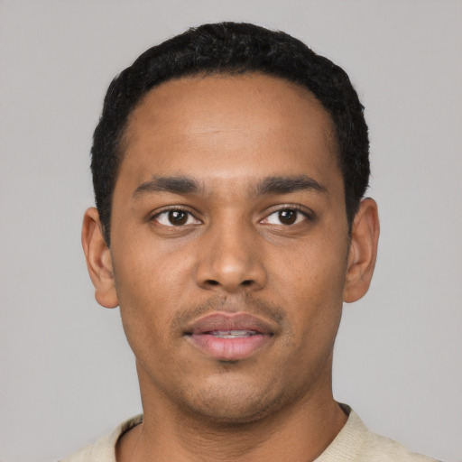 Neutral latino young-adult male with short  black hair and brown eyes