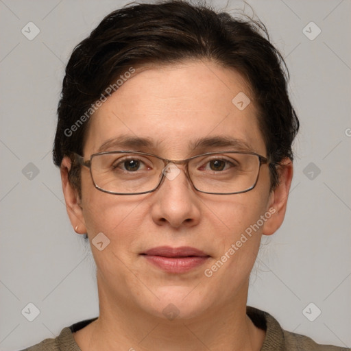 Joyful white adult female with short  brown hair and brown eyes