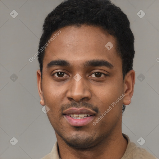 Joyful black young-adult male with short  black hair and brown eyes