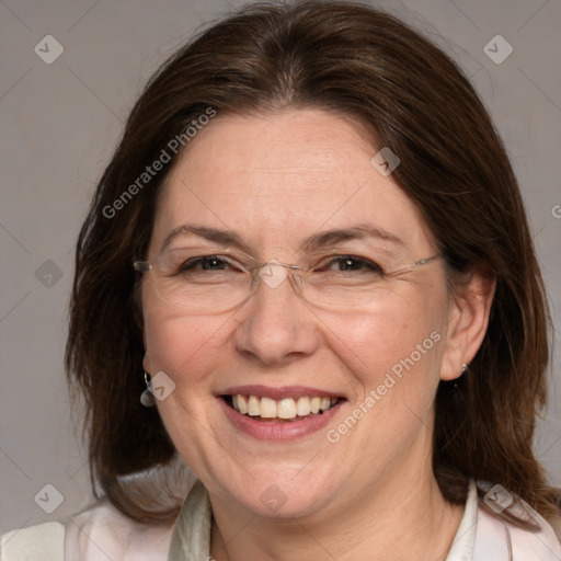 Joyful white adult female with medium  brown hair and grey eyes