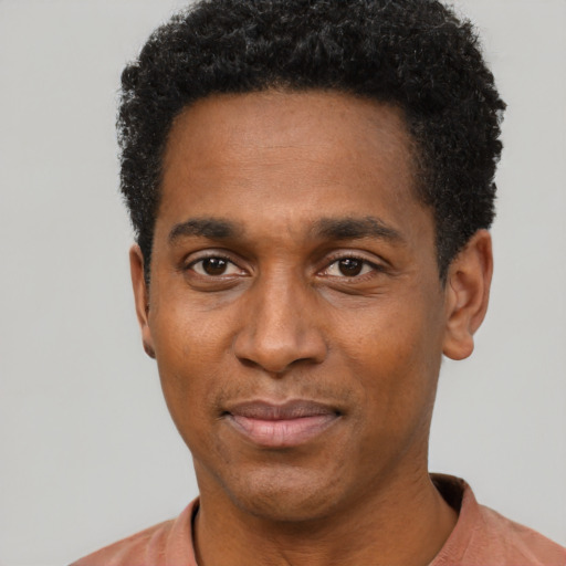 Neutral black young-adult male with short  black hair and brown eyes