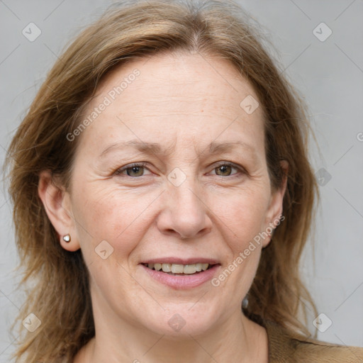 Joyful white adult female with medium  brown hair and grey eyes