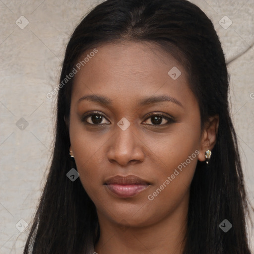 Joyful black young-adult female with long  brown hair and brown eyes