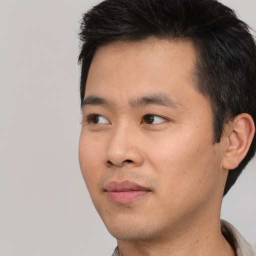 Neutral asian young-adult male with short  black hair and brown eyes