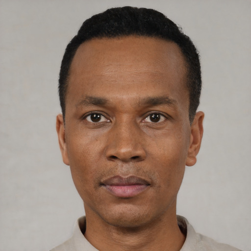 Neutral black adult male with short  black hair and brown eyes