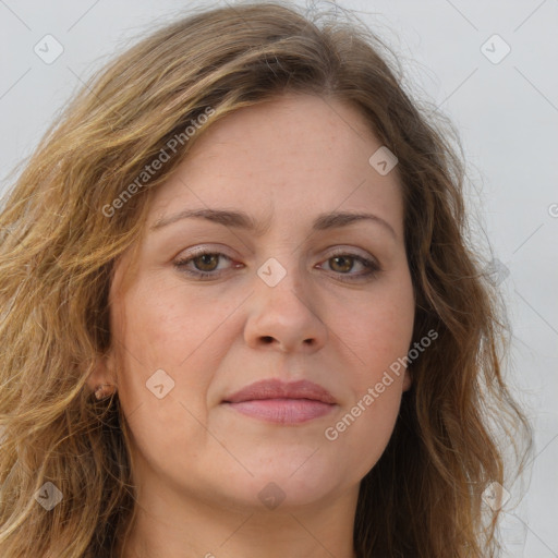 Joyful white adult female with long  brown hair and brown eyes