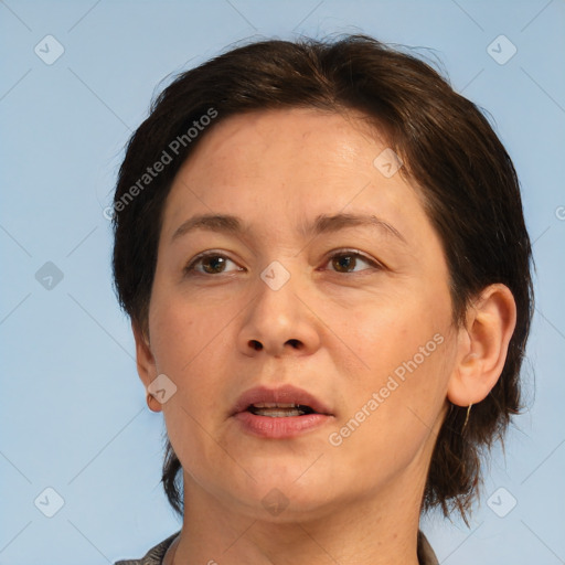 Joyful white adult female with short  brown hair and brown eyes