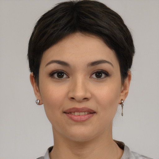 Joyful asian young-adult female with short  black hair and brown eyes