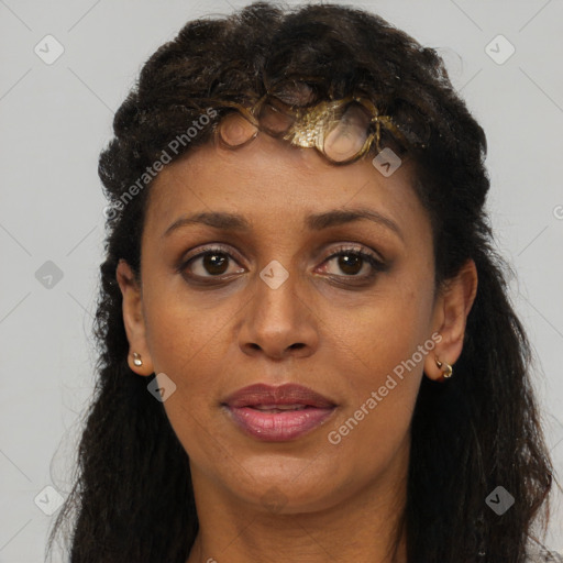 Joyful black young-adult female with long  brown hair and brown eyes