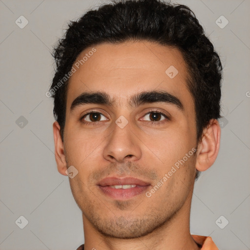 Joyful white young-adult male with short  black hair and brown eyes