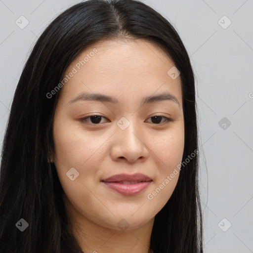 Joyful asian young-adult female with long  brown hair and brown eyes