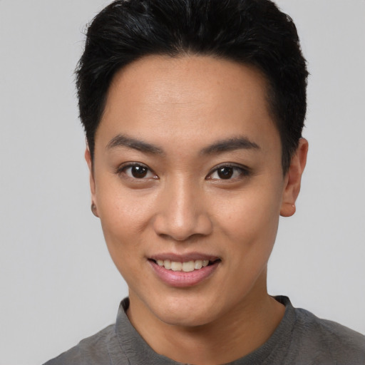 Joyful asian young-adult female with short  black hair and brown eyes
