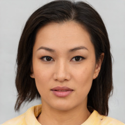 Neutral asian young-adult female with medium  brown hair and brown eyes