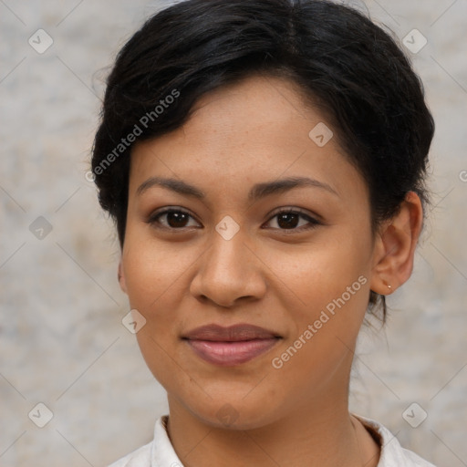 Joyful latino young-adult female with short  brown hair and brown eyes