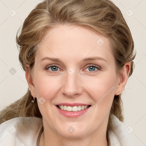 Joyful white young-adult female with long  brown hair and blue eyes