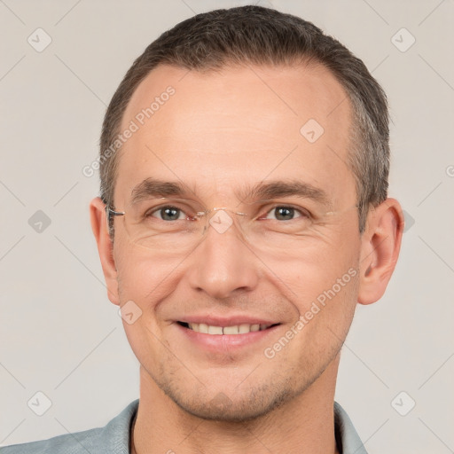 Joyful white adult male with short  brown hair and brown eyes