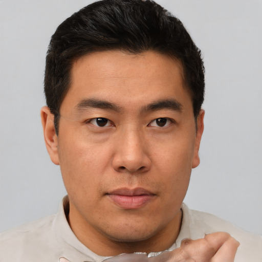 Neutral asian young-adult male with short  brown hair and brown eyes