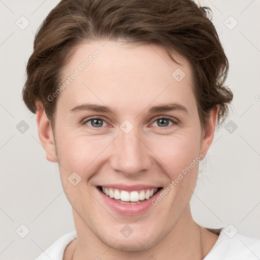 Joyful white young-adult female with short  brown hair and grey eyes