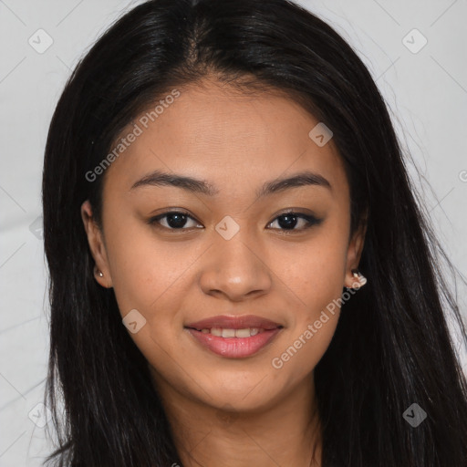 Joyful asian young-adult female with long  brown hair and brown eyes