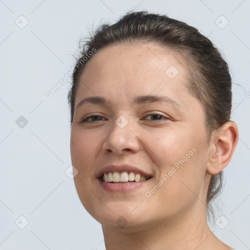 Joyful white young-adult female with short  brown hair and brown eyes