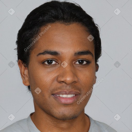 Joyful black young-adult male with short  black hair and brown eyes