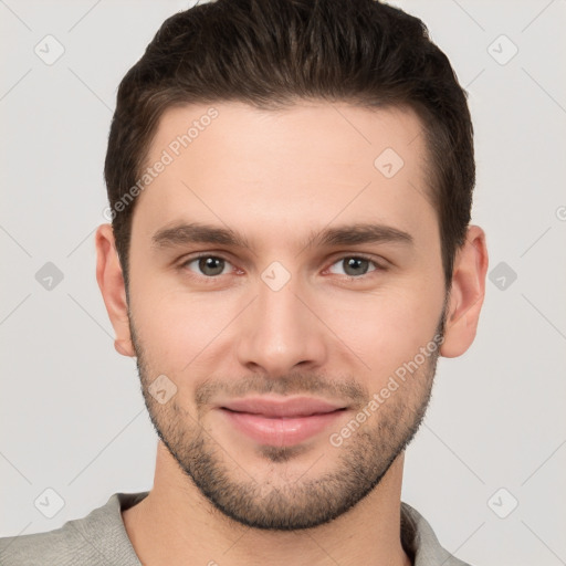 Joyful white young-adult male with short  brown hair and brown eyes