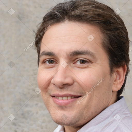 Joyful white adult male with short  brown hair and brown eyes