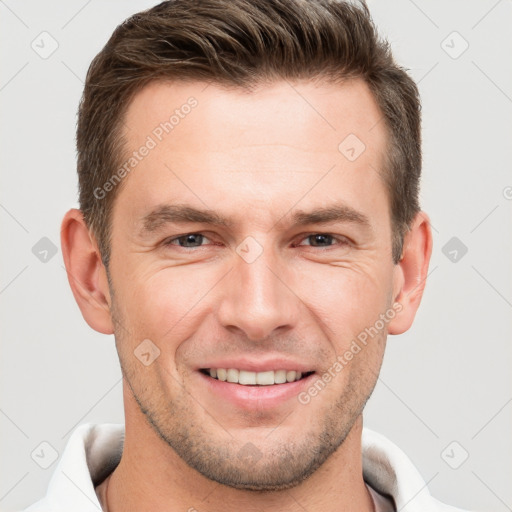 Joyful white young-adult male with short  brown hair and brown eyes