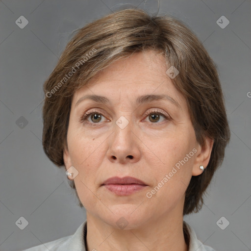 Joyful white adult female with medium  brown hair and grey eyes