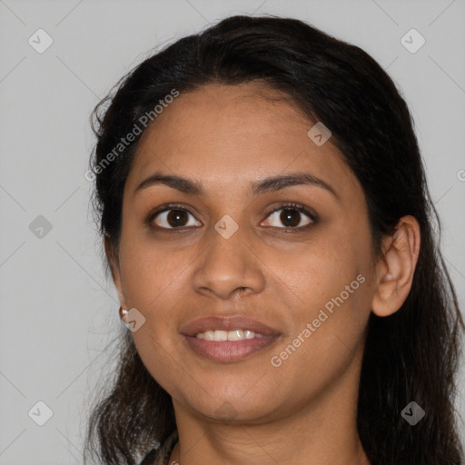 Joyful latino young-adult female with long  black hair and brown eyes