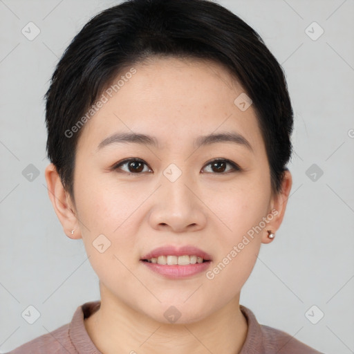 Joyful asian young-adult female with short  brown hair and brown eyes