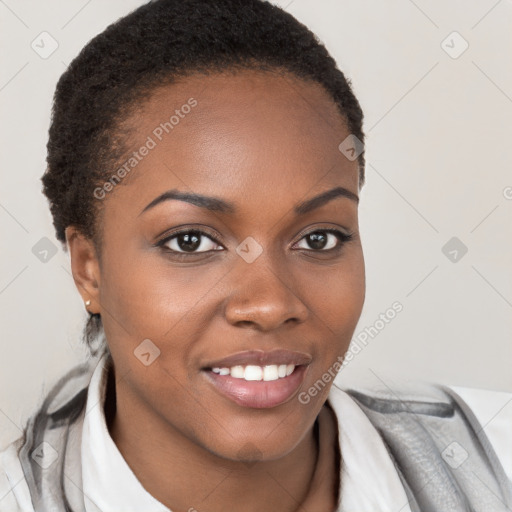 Joyful black young-adult female with short  brown hair and brown eyes