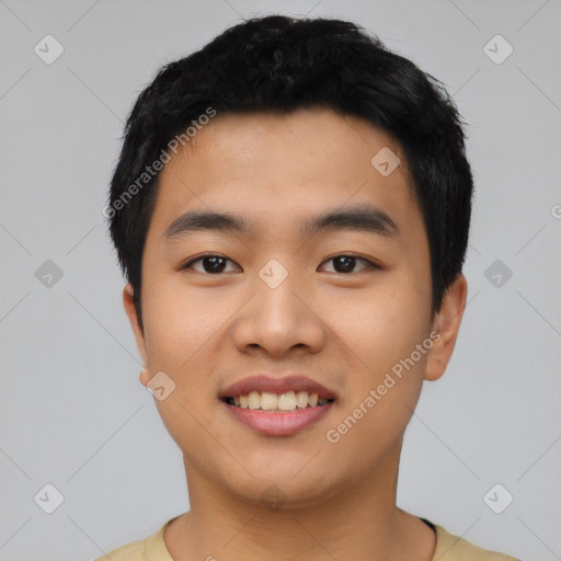 Joyful asian young-adult male with short  black hair and brown eyes