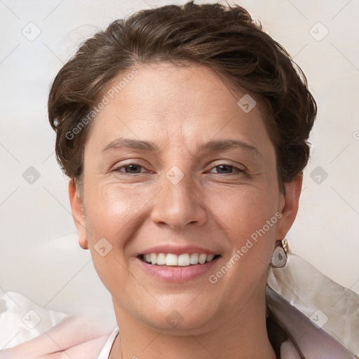 Joyful white adult female with short  brown hair and brown eyes