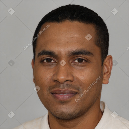 Joyful black young-adult male with short  black hair and brown eyes