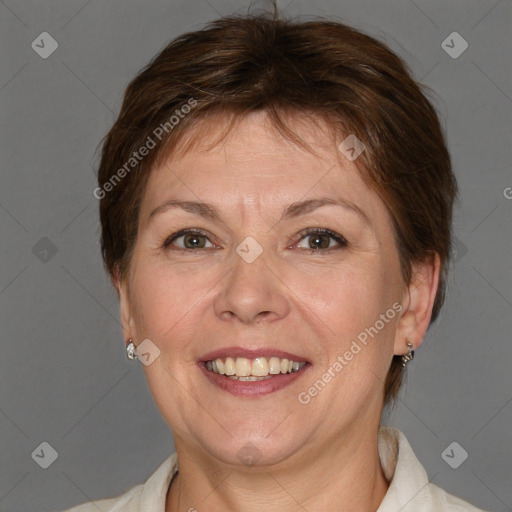 Joyful white adult female with medium  brown hair and blue eyes