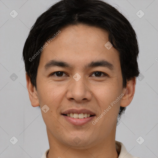 Joyful asian young-adult male with short  brown hair and brown eyes