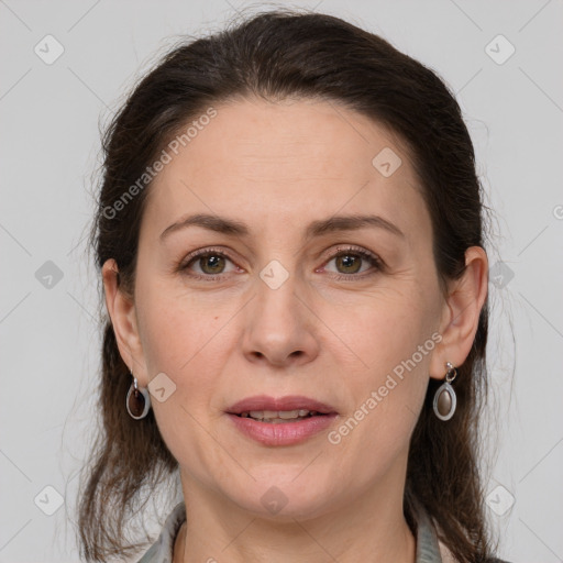 Joyful white adult female with medium  brown hair and grey eyes