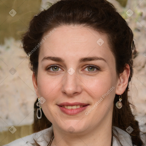 Joyful white young-adult female with medium  brown hair and green eyes