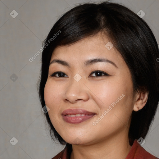 Joyful asian young-adult female with medium  black hair and brown eyes