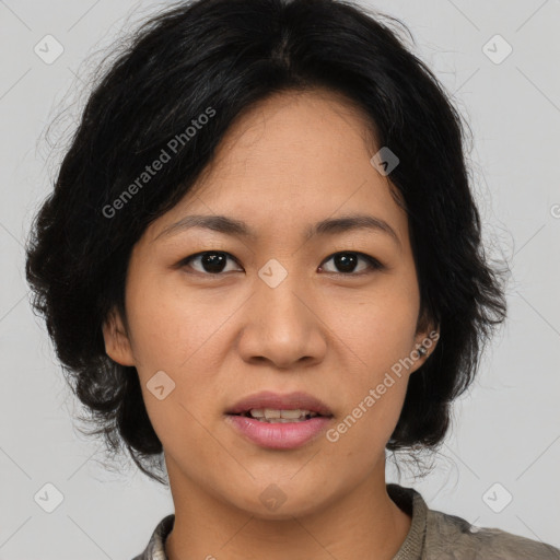 Joyful asian young-adult female with medium  brown hair and brown eyes