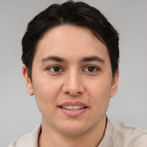 Joyful white young-adult male with short  brown hair and brown eyes