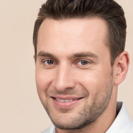 Joyful white young-adult male with short  brown hair and brown eyes