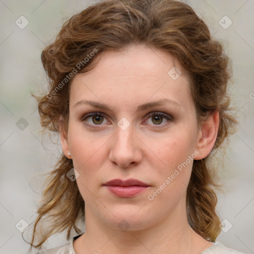 Joyful white young-adult female with medium  brown hair and blue eyes