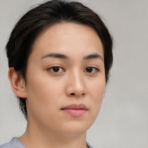 Neutral asian young-adult female with medium  brown hair and brown eyes