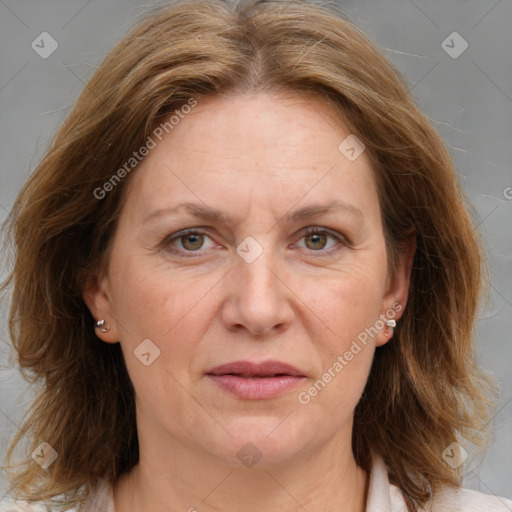 Joyful white adult female with medium  brown hair and grey eyes